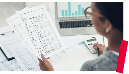 Woman looking at spreadsheets